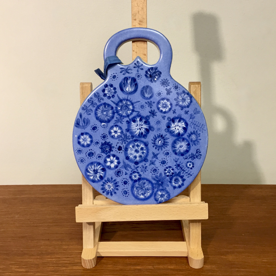 A Blue Hand Painted Cutting Board by Arabia